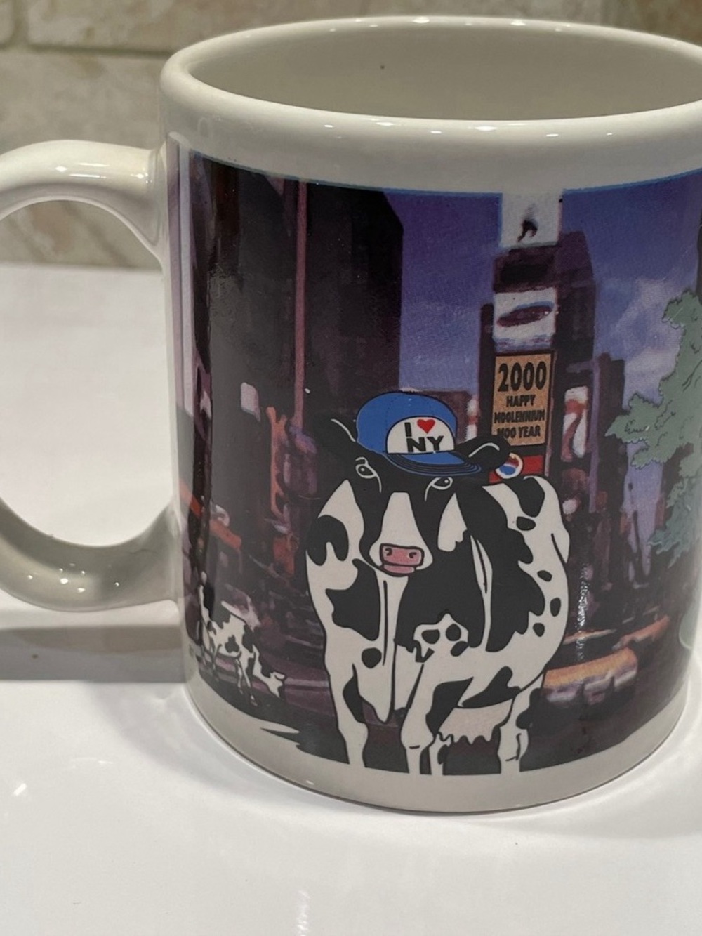 White Ceramic Cow Print Mug with Blue Accent